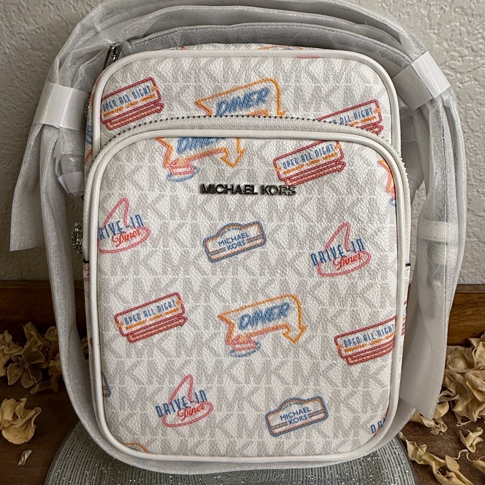 Michael Kors Crossbody lmt’d edition. Available in white and another in orange.